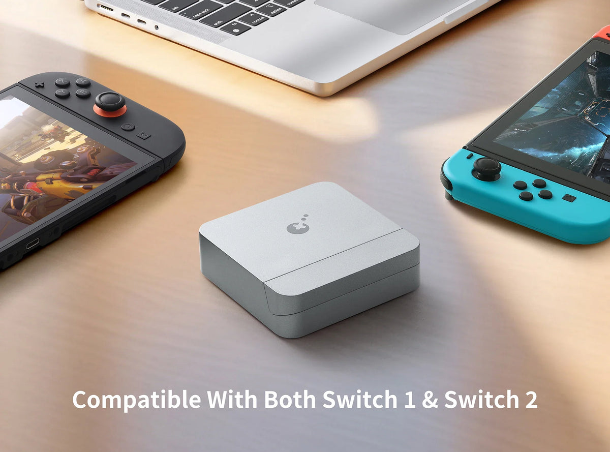Switch 2 accessories worth buying: the GuliKit NS35 dock on a desk between two Switch consoles